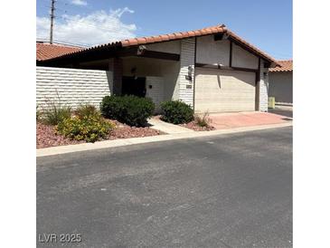 Charming single-story home featuring a two-car garage and low maintenance landscaping at 2100 Plaza Del Padre, Las Vegas, NV 89102