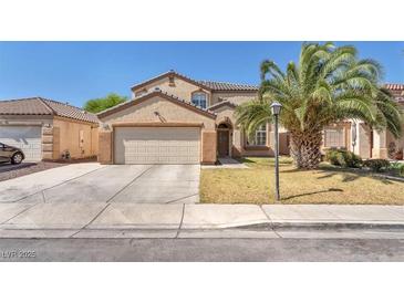 Charming two-story home with a well-manicured lawn and a spacious two-car garage at 2104 Spanish Town Ave, North Las Vegas, NV 89031