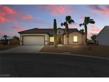 Charming single-story home with desert landscaping, and a convenient attached two-car garage at 2612 Dearport Ct, Henderson, NV 89052