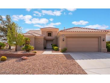 Charming single-story home boasts a desert landscape, neutral colors and tile roof at 10901 Fort Valley Ave, Las Vegas, NV 89134
