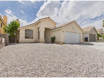 Charming single-story home featuring low maintenance desert landscaping at 1305 Pagentry Dr, North Las Vegas, NV 89031