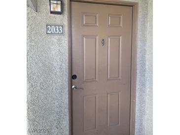 Neutral colored front door with house number 2033 at 4400 S Jones Blvd # 2033, Las Vegas, NV 89103