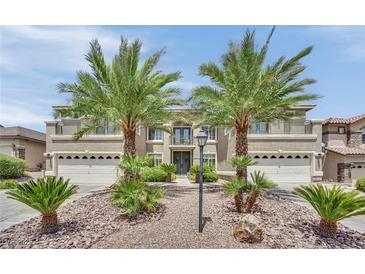 Beautiful two-story home with desert landscaping, a dual garage, and a second-story balcony at 9046 Barium Rock Ave, Las Vegas, NV 89143