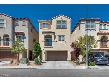 Charming two-story home with a well-manicured front yard and a two-car garage at 10519 Mann St, Las Vegas, NV 89141