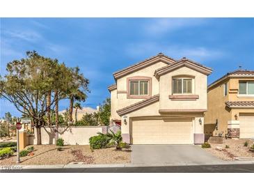 Charming two-story home with a two-car garage and desert landscaping at 170 Wicked Wedge Way, Las Vegas, NV 89148