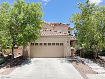 Charming two-story home featuring a two-car garage and mature landscaping at 740 White Grotto St, Las Vegas, NV 89138