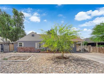 Charming single story home with gray exterior, brick detail, drought landscaping, and mature tree at 1320 Wengert Ave, Las Vegas, NV 89104