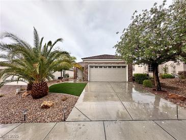 Charming single-story home with well-manicured landscaping and a two-car garage at 2558 Divine Sky Dr, Henderson, NV 89044