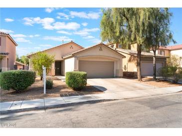 Charming single-story home featuring a two-car garage and well-manicured landscaping at 2833 Swanson Ave, North Las Vegas, NV 89086