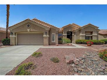 Charming single-story home with a desert landscaped front yard and attached two car garage at 2929 Haddon Dr, Las Vegas, NV 89134
