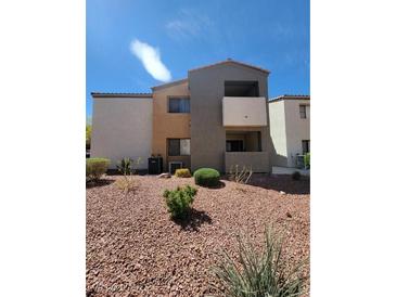 A well-kept exterior view of the condo with desert landscaping on a sunny day at 3151 Soaring Gulls Dr # 2101, Las Vegas, NV 89128