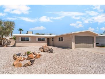 Charming single-story home with a low-maintenance desert-style yard and attached garage at 5245 Hillman Ave, Las Vegas, NV 89142