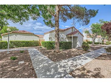 Charming single-story home with well-maintained landscaping and a cozy, inviting front yard at 5401 Bugle Way # 103, Las Vegas, NV 89108