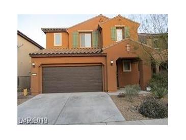 Attractive two-story home featuring an attached two car garage and desert landscaping at 11014 Great Sioux Rd, Las Vegas, NV 89179