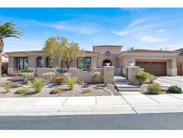 Stunning single-story home featuring a desert landscaped yard, gated entrance and a spacious two car garage at 1725 Cypress Manor Dr, Henderson, NV 89012
