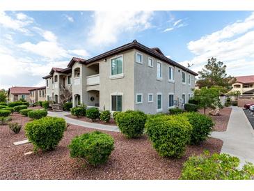 Inviting condo exterior with manicured landscaping and a community atmosphere at 3515 Cactus Shadow St # 104, Las Vegas, NV 89129