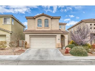 Two-story home featuring a two-car garage, low maintenance desert landscaping, and a neutral color palette at 3964 Irvin Ave, Las Vegas, NV 89141