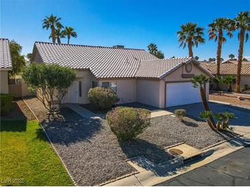 Charming single-story home features a well-maintained front yard with desert landscaping and a two-car garage at 4653 Califa Dr, Las Vegas, NV 89122
