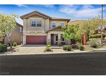 Charming two-story home with a manicured front yard and an inviting covered porch at 10697 Acacia Park Pl, Las Vegas, NV 89135