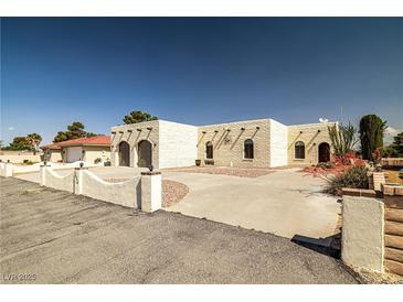 Charming single-story home with desert landscaping and a spacious front yard at 1320 Daytona St, Pahrump, NV 89048
