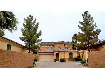Charming two-story home featuring desert landscaping, a tile roof, and a welcoming front entrance at 153 Via Di Mello, Henderson, NV 89011