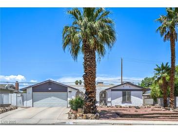 Charming single-story home featuring desert landscaping and an attached two-car garage at 4461 Greenhill Dr, Las Vegas, NV 89121