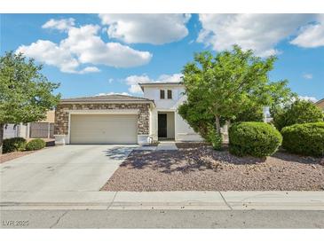 Charming home with a stone-accented facade, well-manicured landscaping, and a spacious two-car garage at 564 Lampshire Ln, Pahrump, NV 89060