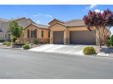 Charming single-story home with a tiled roof and a three-car garage, framed by desert landscaping at 6567 American Eagle Ave, Las Vegas, NV 89131
