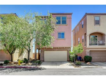 Charming two-story home with stucco exterior, attached garage, and mature landscaping at 6622 Colorado Spruce St, Las Vegas, NV 89149