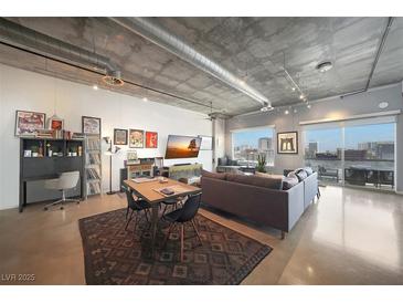 Bright open floor plan with modern finishes, polished concrete floors, and floor to ceiling windows with city views at 900 Las Vegas Blvd # 715, Las Vegas, NV 89101