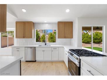 Bright kitchen with stainless steel appliances, white countertops, and a window view at 2913 Hawksdale Dr, Las Vegas, NV 89134