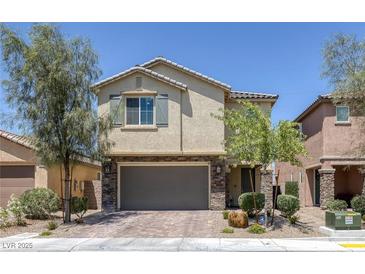 Charming two-story home with stone accents and a well-maintained front yard at 4050 Midnight Crest Ave, North Las Vegas, NV 89031