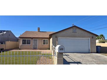 Charming single-story home featuring a well-maintained front yard and attached garage at 4690 E California Ave, Las Vegas, NV 89104
