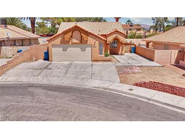 Charming single-Gathering home features a large driveway, two-car garage, and well-maintained landscaping at 5536 Cleary Ct, Las Vegas, NV 89108