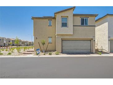 Modern two-story home with a two-car garage and low-maintenance landscaping at 6835 Orange Horizon St, North Las Vegas, NV 89086