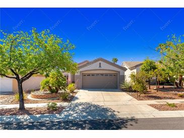 Charming single-story home with well-manicured landscaping and a two-car garage at 2185 High Mesa Dr, Henderson, NV 89012