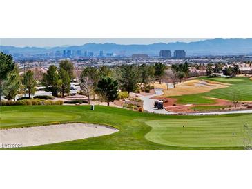 Scenic golf course view showcasing lush green fairways and distant city skyline at 2521 Roseworthy Dr, Las Vegas, NV 89134