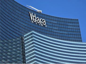 Exterior shot of Vdara Hotel & Spa featuring the Vdara logo against a clear blue sky at 2600 W Harmon Ave # 20034, Las Vegas, NV 89158