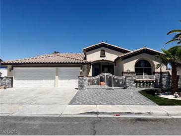 Charming single-story home featuring a gated entry, a three-car garage, and low-maintenance landscaping at 3064 Azure Bay St, Las Vegas, NV 89117