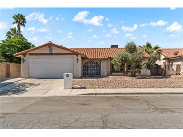 Charming single-story home featuring a well-maintained front yard and a two-car garage at 3941 Boca Grande Ave, Las Vegas, NV 89120