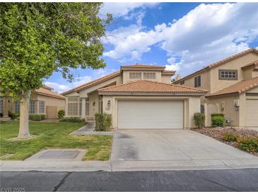 Charming single-Gathering home boasting a well-manicured lawn and a two-car garage at 5452 Big Sky Ln, Las Vegas, NV 89149