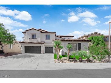 Inviting two-story home featuring a spacious driveway and desert landscaping, creating great curb appeal at 8268 Nelson Ridge Ln, Las Vegas, NV 89178