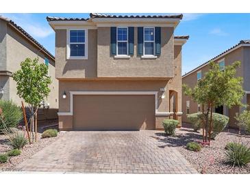 Two-story home with a paved driveway and a two-car garage at 9198 Harbin Ave, Las Vegas, NV 89148