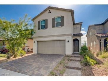 Charming two-story home with a two-car garage and paved driveway at 1637 Harvest Pecan Ct, Las Vegas, NV 89108