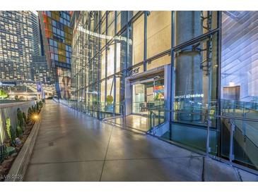 Modern building entrance featuring a sleek glass facade and well-lit walkway at 3722 Las Vegas Blvd # 2509, Las Vegas, NV 89158