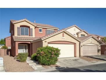 Charming two-story home features a two-car garage and low-maintenance landscaping at 5573 La Perla Ct, Las Vegas, NV 89122