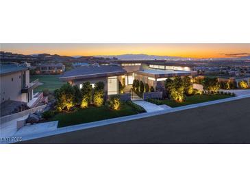 Stunning contemporary home featuring professional landscaping and city views at 641 Majestic Rim Dr, Henderson, NV 89012