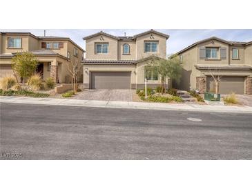 Charming two-story home with landscaped yard, and neutral colored stucco exterior at 10376 Sadie Blake Ave, Las Vegas, NV 89166