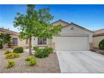 Charming single-story home featuring desert landscaping, a two-car garage, and a cozy, inviting facade at 10929 Vallerosa St, Las Vegas, NV 89141