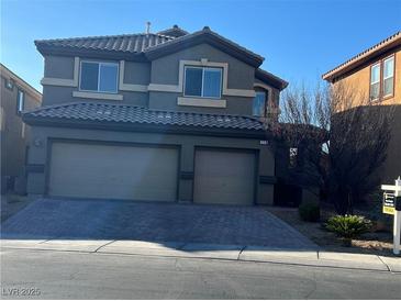 Charming two-story home featuring a two-car garage and well-maintained front yard at 117 Logan Pond Way, North Las Vegas, NV 89084